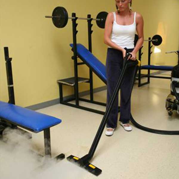 Gym floor maintenance with steam vacuum cleaner